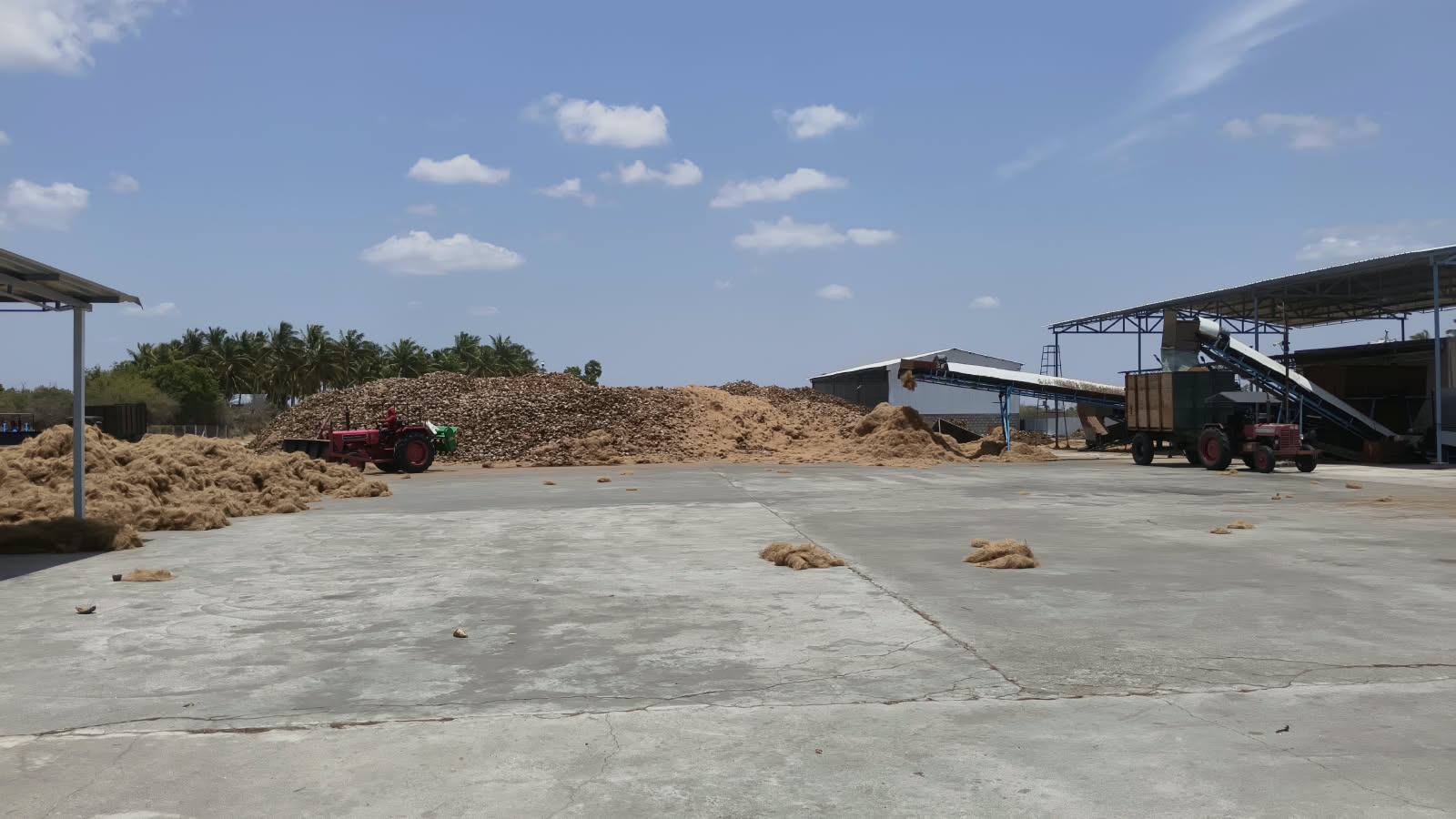 Coir fibre bales and cocopeat blocks inside a coir processing facility